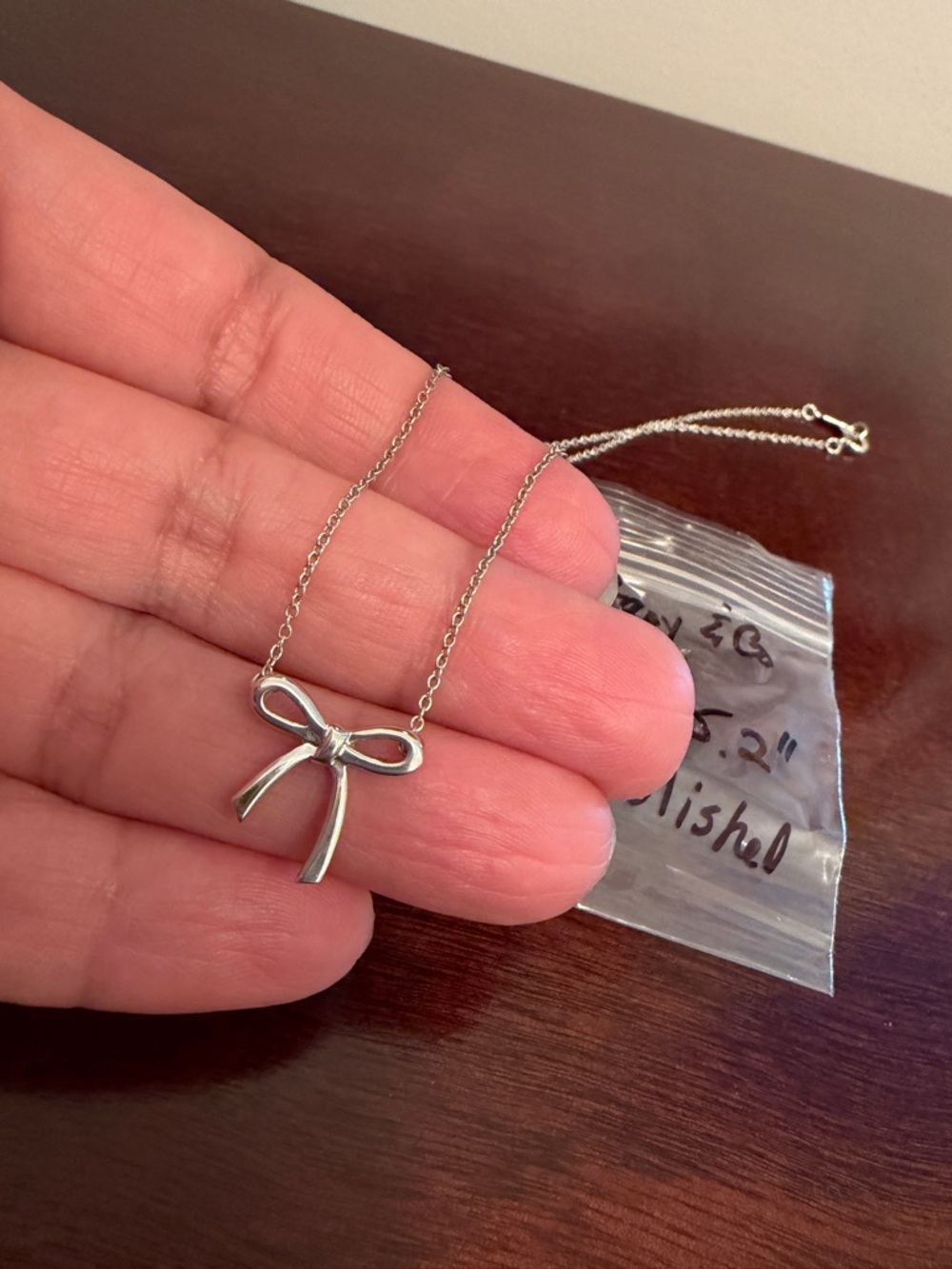 authentic Tiffany & Co. Elsa Peretti Bow Necklace made of 925 sterling silver.